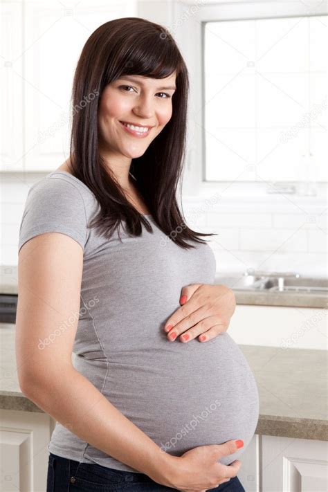 big pregnant belly pictures|pregnant woman holding her stomach.